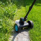 Autonix GT-20 cutting overgrown weeds into a razor sharp edge along a stone garden path